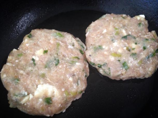 Raw chicken patties about to be pan-fried