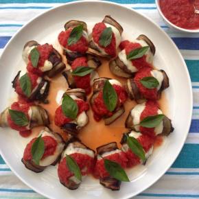 Eggplant, spinach and Bocconcini rolls with tomato sauce and&nbsp;basil.
