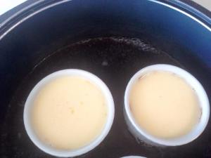 Mould in pot surrounded with water ready to be baked